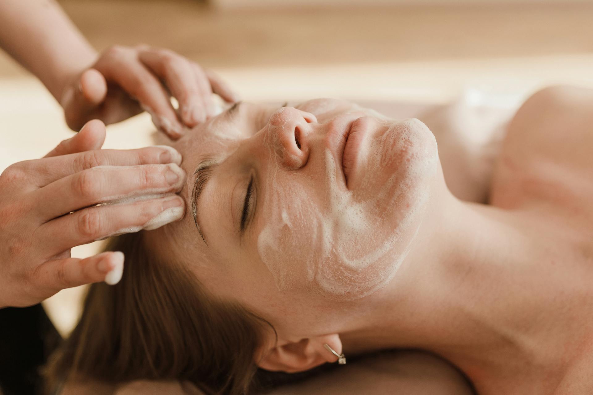 A Woman Having a Facial Treatment - Photo by Arina Krasnikova: https://www.pexels.com/photo/a-woman-having-a-facial-treatment-6663368/